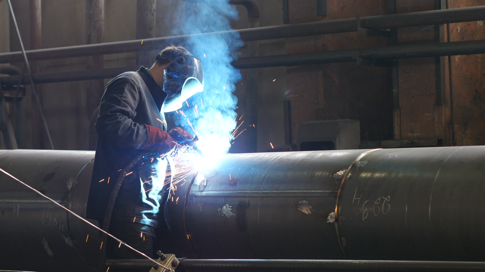 Welder laying a TIG bead in the EMS shop